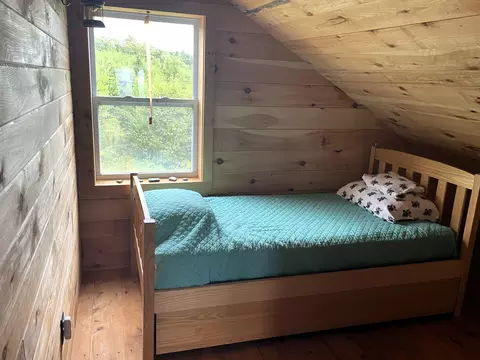 Bedroom - 1261 Dirigo Rd, Enchanted Twp, ME 04945 photo 2 of 3