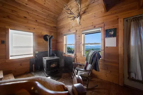 Living - 1261 Dirigo Rd, Enchanted Twp, ME 04945 photo 2 of 3