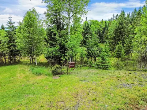 Exterior - 41 Stone Hedge Ln, Rangeley, ME 04970 photo 2 of 4