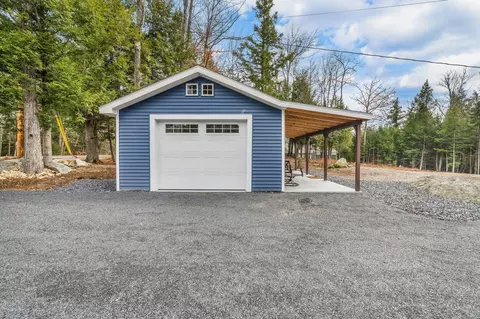 Exterior - 52 E Shore Rd, Embden, ME 04958 photo 4 of 13