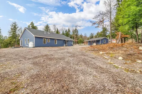 Exterior - 52 E Shore Rd, Embden, ME 04958 photo 11 of 13