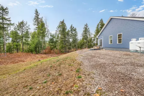 Exterior - 52 E Shore Rd, Embden, ME 04958 photo 12 of 13