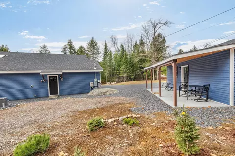 Exterior - 52 E Shore Rd, Embden, ME 04958 photo 9 of 13