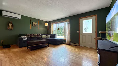 Living - 49 Hughes Rd, Mapleton, ME 04757 photo 1 of 6