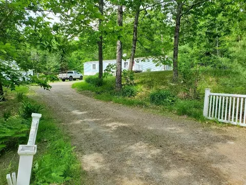 Exterior - 406 Shadow Ln, Etna, ME 04434 photo 8 of 12
