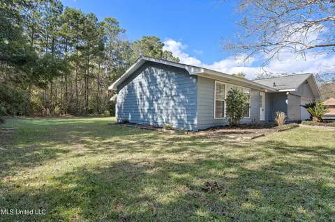 Exterior - 56114 E Diamondhead Dr, Diamondhead, MS 39525 photo 6 of 7