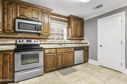 Kitchen - 18073 W 3rd St, Saucier, MS 39574 photo 4 of 6