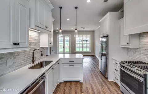 Kitchen - 502 Black Cherry Cv, Canton, MS 39046 photo 8 of 14