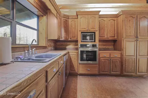 Kitchen - 17542 Jones Ln, Saucier, MS 39574 photo 2 of 3