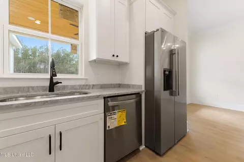 Kitchen - 13401 Cox Rd, Vancleave, MS 39565 photo 2 of 2