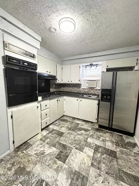 Kitchen - 57 S Main St, Holcomb, MS 38940 photo 2 of 2
