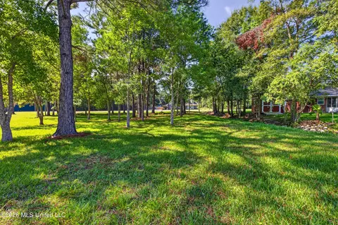 Exterior - 56113 E Diamondhead Dr, Diamondhead, MS 39525 photo 9 of 15