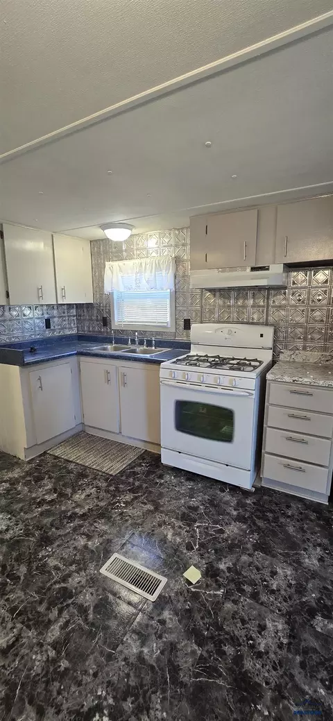 Kitchen - 216 W Box Elder Rd, Box Elder, SD 57719 photo 2 of 2