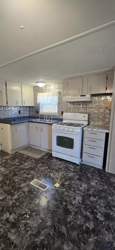 Kitchen - 216 W Box Elder Rd, Box Elder, SD 57719 photo 1 of 2