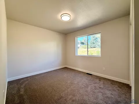 Bedroom - 827 Heritage Dr, Belle Fourche, SD 57717 photo 5 of 5
