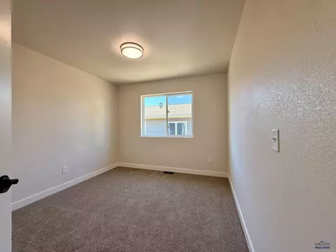 Bedroom - 827 Heritage Dr, Belle Fourche, SD 57717 photo 2 of 5