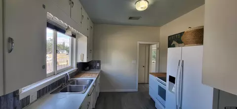 Kitchen - 222 E Maple St, Rawlins, WY 82301 photo 1 of 2